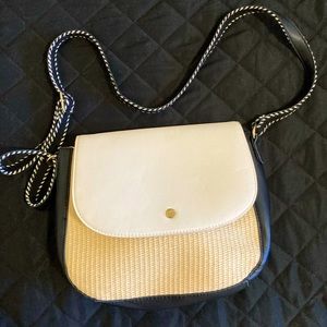 Tan, black, and white crossbody purse